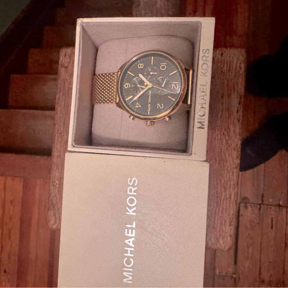 Michael Kors gold plated watch. I paid 175 for it. Wore once needs new battery.